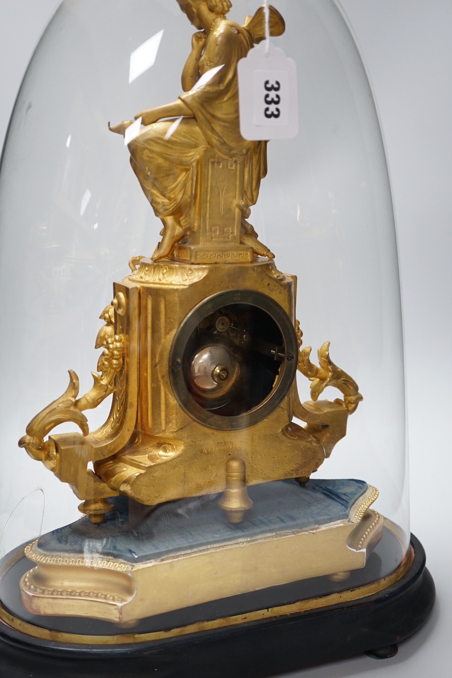 A French 19th century gilt metal clock by Phillipe H. Mourey on stand with glass dome, total height 49cm (dome a.f.)